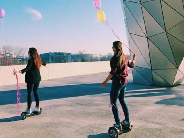 These two girls outside Musée des Confluences in Lyon, France are on hoverboards with baloons and make for a perfect Instagram post. (Instagram/mline17)