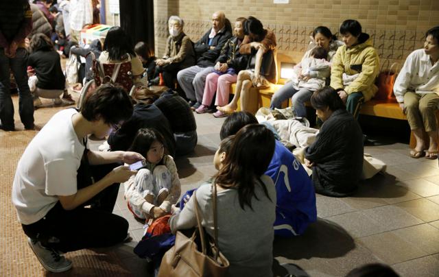 Hotel guests gather in the lobby after being evacuated from their rooms following an earthquake early Saturday, April 16, 2016, in Kumamoto, southern Japan. (ap)