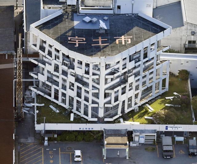 Exterior wall of the city hall fall off after the earthquake in Uto, Kumamoto prefecture, southern Japan. (AP)