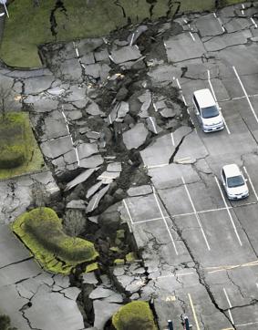 In this aerial photo, a parking lot is seen damaged by the earthquake in Minamiaso town, Kumamoto prefecture. (AP)
