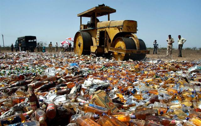 A road roller crushes bottles of liquor seized in 2009 in the dry state of Gujarat, where all sale and consumption is banned. In Mumbai, Prohibition had to be steadily scaled back into a licence raj as implementation failed and bootleggers turned gangsters, sparking a law-and-order situation.(PTI) A road roller crushes bottles of liquor seized in 2009 in the dry state of Gujarat, where all sale and consumption is banned. In Mumbai, Prohibition had to be steadily scaled back into a licence raj as implementation failed and bootleggers turned gangsters, sparking a law-and-order situation.(PTI)