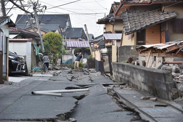 Crack in the ground caused by the earthquake are seen in Mashiki, Kumamoto prefecture. (AFP)