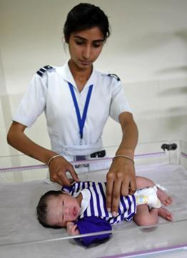The baby being checked up by a nurse on Friday. (Gurminder Singh/HT Photo)