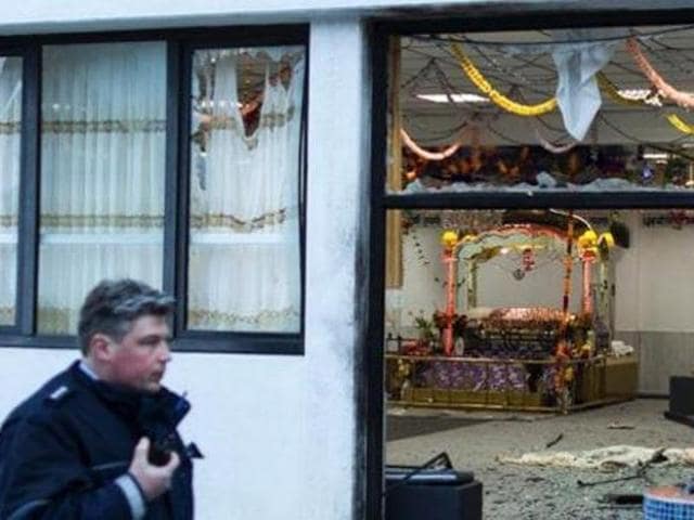A German policeman stands guard at a gurdwara in the western city of Essen. (German Media) A German policeman stands guard at a gurdwara in the western city of Essen. (German Media)