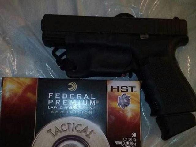 A photo Phillips had uploaded onto his Facebook account of a semi-automatic pistol and a box of ammunition. (Photo Courtesy: Maurice Phillips Facebook) A photo Phillips had uploaded onto his Facebook account of a semi-automatic pistol and a box of ammunition. (Photo Courtesy: Maurice Phillips Facebook)