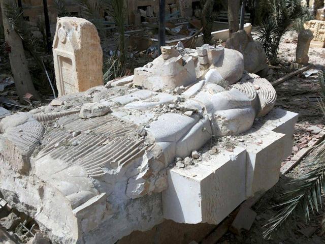 This photo released on Sunday March 27, 2016, by the Syrian official news agency SANA, shows a destroyed statue outside the damaged Palmyra Museum. (AP Photo) This photo released on Sunday March 27, 2016, by the Syrian official news agency SANA, shows a destroyed statue outside the damaged Palmyra Museum. (AP Photo)