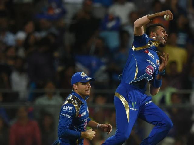 Jos Buttler (L) looks on as Hardik Pandya celebrates after taking a catch to dismiss Brendon McCullum. (AFP) Jos Buttler (L) looks on as Hardik Pandya celebrates after taking a catch to dismiss Brendon McCullum. (AFP)