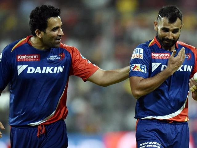 Delhi Daredevils Zaheer Khan and Mohammad Shami in action against Royal Challengers Bangalore. (MOHD Zakir/HT Photo) 
