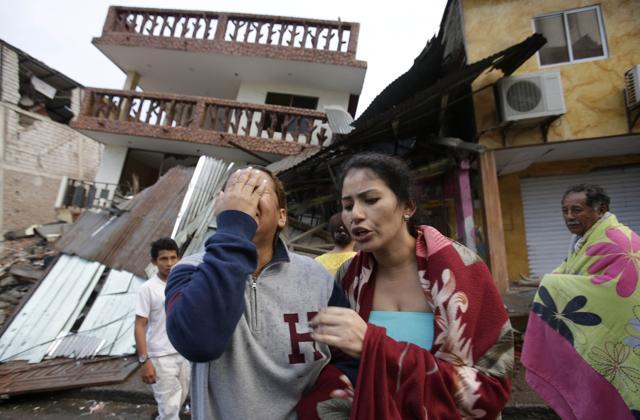 A woman cries as she stands next to a house destroyed by the earthquake in the Pacific coastal town of Pedernales. (AP Photo) A woman cries as she stands next to a house destroyed by the earthquake in the Pacific coastal town of Pedernales. (AP Photo)