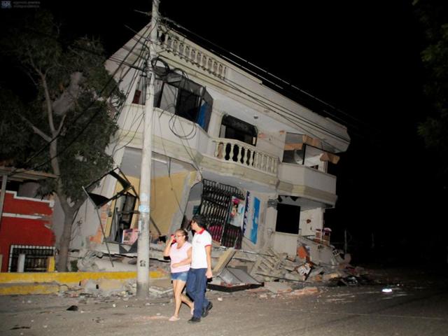 Residents walk on a street amid destroyed buildings following an earthquake in Guayaquil. (AFP Photo) Residents walk on a street amid destroyed buildings following an earthquake in Guayaquil. (AFP Photo)