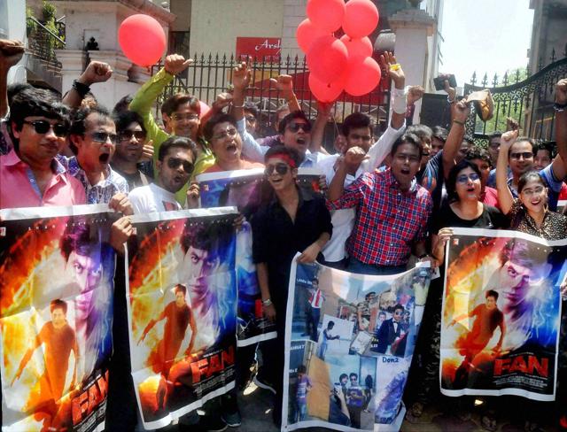 Fans of actor Shah Rukh Khan jubilate in front of a cinema hall as they arrive to watch his movie Fan, in Kolkata on Friday. (PTI) Fans of actor Shah Rukh Khan jubilate in front of a cinema hall as they arrive to watch his movie Fan, in Kolkata on Friday. (PTI)