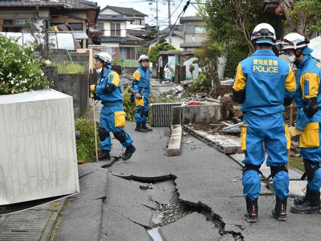 Policemen search for missing people in a damaged neighbourhood following two earthquakes in the region in Mashiki, Kumamoto prefecture. (AFP) Policemen search for missing people in a damaged neighbourhood following two earthquakes in the region in Mashiki, Kumamoto prefecture. (AFP)
