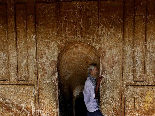 A man at the Rumi Darwaza of Bara Imambara, the construction of which was started in 1785, a year of a devastating famine. (Raj K Raj/HT Photos ) A man at the Rumi Darwaza of Bara Imambara, the construction of which was started in 1785, a year of a devastating famine. (Raj K Raj/HT Photos )