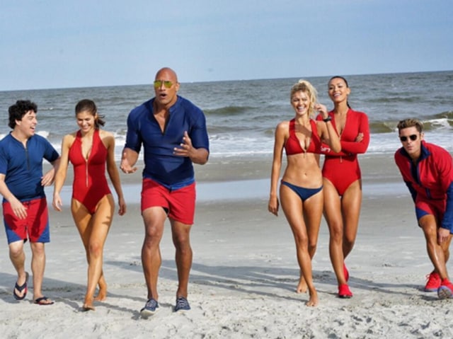 From left: Jon Bass, Alexandra Daddario, Dwayne Johnson, Kelly Rohrbach, Ilfenesh Hadera and Zac Efron, all Baywatching. (Instagram) 