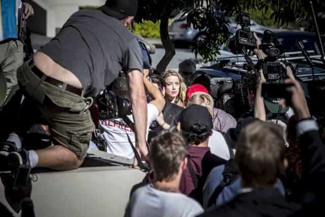 Amber Heard, wife of actor Johnny Depp arrives at the Southport Magistrates Court on Australia's Gold Coast. (REUTERS) Amber Heard, wife of actor Johnny Depp arrives at the Southport Magistrates Court on Australia's Gold Coast. (REUTERS)