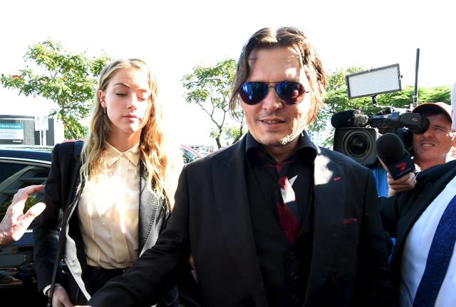 Actor Johnny Depp and wife Amber Heard arrive at the Southport Magistrates Court on Australia's Gold Coast, April 18, 2016. (REUTERS) Actor Johnny Depp and wife Amber Heard arrive at the Southport Magistrates Court on Australia's Gold Coast, April 18, 2016. (REUTERS)