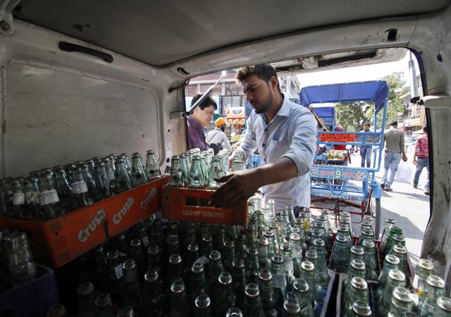 These bottles are manufactured and filled with soda, mostly in UP’s Meerut and other states like Punjab. One-room units that fill the bottles after buying them from these dealers operate in Bhogal, Mehrauli and Old Delhi. (Sanchit Khanna/ HT Photos)
