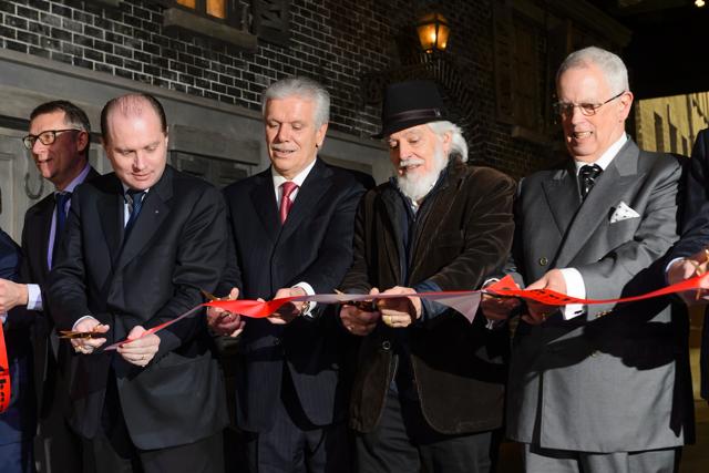 Vaud State councillor Philippe Leuba, Chaplin's World Musuem developer Philippe Meylan and Charlie Chaplin's sons Michael and Eugene cut the ribbon as they inaugurate Chaplin's World Musuem in Corsier-sur-Vevey, western Switzerland. (AFP)