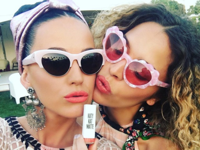 Katy Perry plugs her lip gloss at the festival.  (Instagram) 