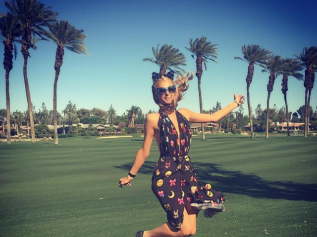 Paris Hilton takes a leap of joy at the 2016 Coachella festival. (Instagram) 