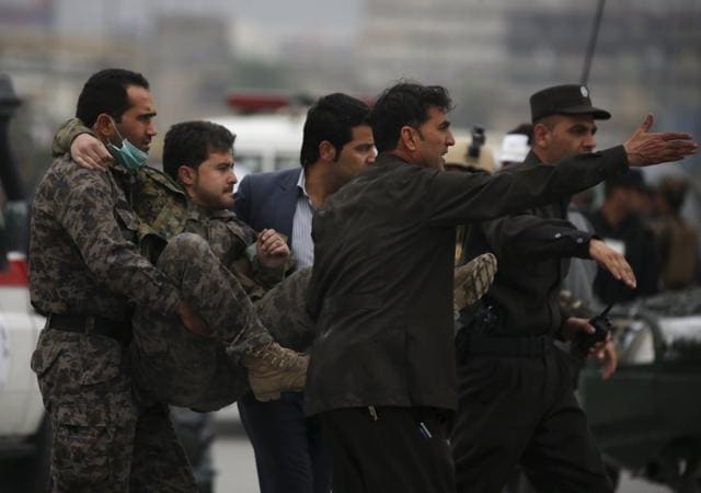 Afghan security forces carry an injured soldier after a suicide car bomb attack in Kabul in Afghanistan on April 19, 2016. (Reuters) Afghan security forces carry an injured soldier after a suicide car bomb attack in Kabul in Afghanistan on April 19, 2016. (Reuters)