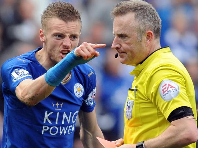 Leicester City’s Jamie Vardy gestures to referee Jonathan Moss after being given a second yellow card.(AP Photo)