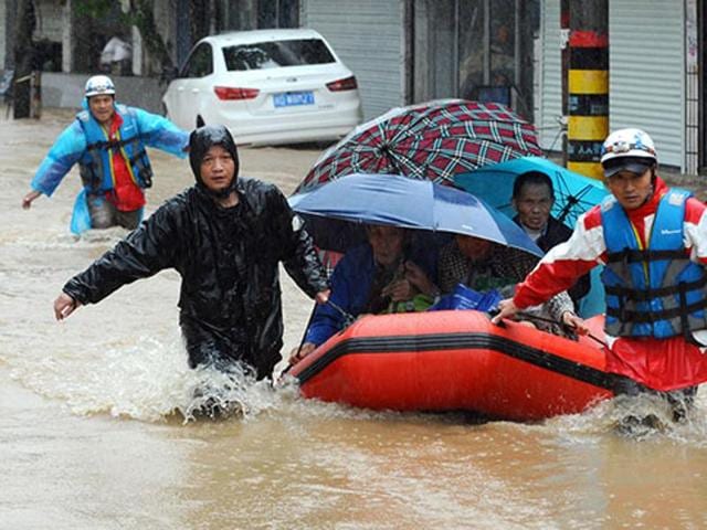 At least six persons, including an Indian-American woman, were killed in “historic” flash flooding here, submerging scores of subdivisions and several major interstate highways and forcing the closure of schools. (AP Photo) At least six persons, including an Indian-American woman, were killed in “historic” flash flooding here, submerging scores of subdivisions and several major interstate highways and forcing the closure of schools. (AP Photo)