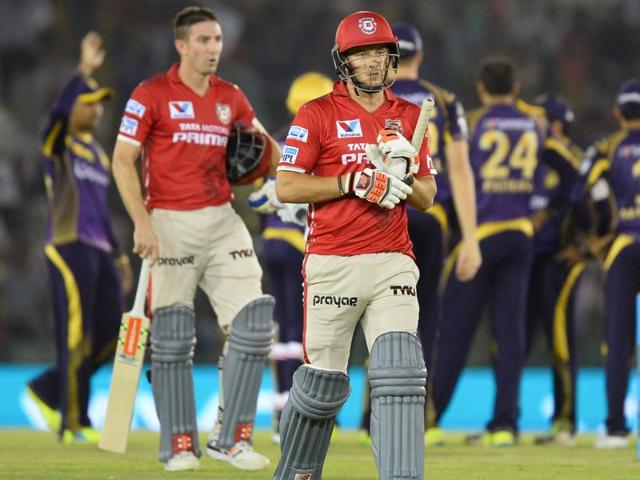 Kings XI Punjab batsman David Miller (front) walks back after being dismissed by Kolkata Knight Riders bowler Yusuf Pathan. (AFP Photo) 