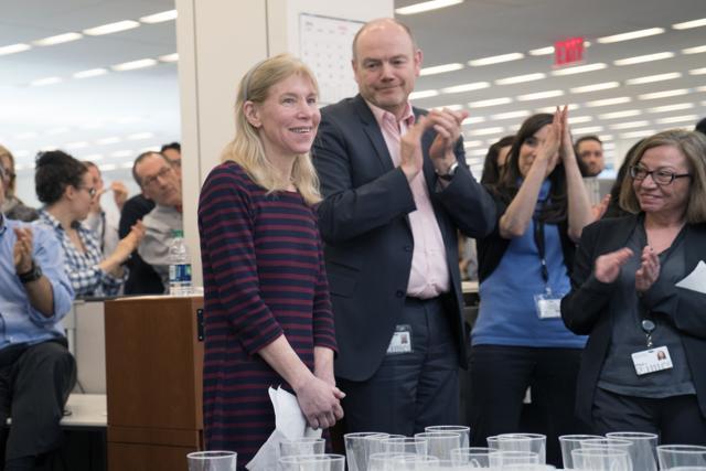 Alissa Rubin of the New York Times, center, is applauded by her colleagues in the newsroom in New York, including chief executive Mark Thompson, center right, after winning the Pulitzer Prize for International Reporting on Monday. (AP) Alissa Rubin of the New York Times, center, is applauded by her colleagues in the newsroom in New York, including chief executive Mark Thompson, center right, after winning the Pulitzer Prize for International Reporting on Monday. (AP)