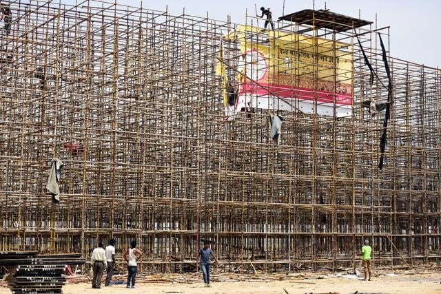File photo of labourers disassembling the stage used during the World Culture Festival organised near Yamuna flood plain, in New Delhi. (Sonu Mehta / HT Photo) File photo of labourers disassembling the stage used during the World Culture Festival organised near Yamuna flood plain, in New Delhi. (Sonu Mehta / HT Photo)