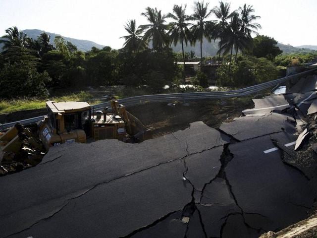 A bulldozer works to clear a section of highway that collapsed due to the 7.8-magnitude earthquake that struck Ecuador on April 16. (AP File Photo) A bulldozer works to clear a section of highway that collapsed due to the 7.8-magnitude earthquake that struck Ecuador on April 16. (AP File Photo)