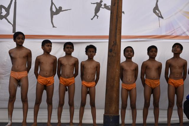 Students of Samarth Vyayam Mandir getting ready to demonstrate their skill  to the students and parents during the opening ceremony of a summer camp at Dadar in Mumbai, India, on Sunday.  (satish bate/Hindustan Times) 