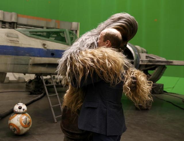 Britain's Prince William is hugged by Chewbacca during a tour of the Star Wars sets at Pinewood studios in Iver Heath, west of London, Britain. (REUTERS) Britain's Prince William is hugged by Chewbacca during a tour of the Star Wars sets at Pinewood studios in Iver Heath, west of London, Britain. (REUTERS)