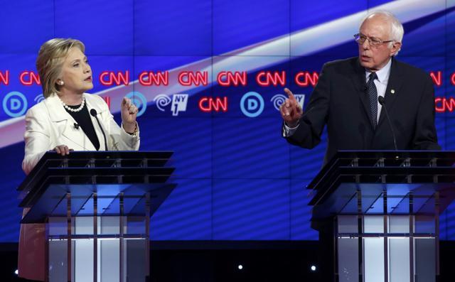 Democratic US presidential candidates Hillary Clinton (L) and Senator Bernie Sanders speak at the same time during a Democratic debate hosted by CNN and New York One at the Brooklyn Navy Yard in New York April 14, 2016. (REUTERS) Democratic US presidential candidates Hillary Clinton (L) and Senator Bernie Sanders speak at the same time during a Democratic debate hosted by CNN and New York One at the Brooklyn Navy Yard in New York April 14, 2016. (REUTERS)