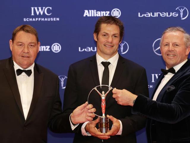 Richie McCaw, center, captain of the All Blacks, and former rugby player Sean Fitzpatrick, right, and New Zealand's head coach Steve Hansen collect the Laureus Team of the Year award on behalf of the All Blacks. (AP) Richie McCaw, center, captain of the All Blacks, and former rugby player Sean Fitzpatrick, right, and New Zealand's head coach Steve Hansen collect the Laureus Team of the Year award on behalf of the All Blacks. (AP)