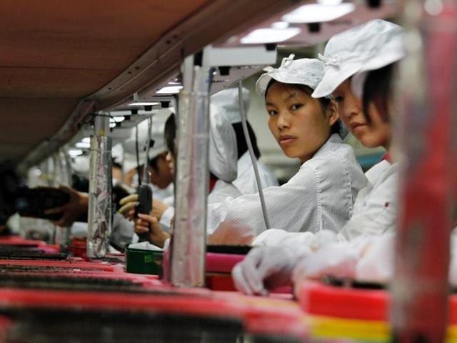 Workers are seen inside a Foxconn factory in the township of Longhua in the southern Guangdong province May 26, 2010. (REUTERS) Workers are seen inside a Foxconn factory in the township of Longhua in the southern Guangdong province May 26, 2010. (REUTERS)