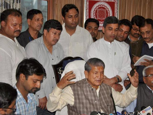 Deposed Uttarakhand chief minister (centre) has filed a plea against the imposition of President’s Rule in the state.(PTI)