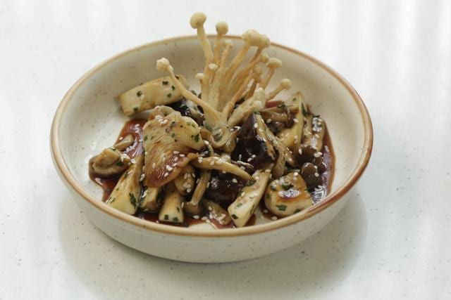 The untraditional ceviche has enoki, oyster mushroom, trumpet, shimeji, and shiitake in a soy-dark, tangy ponzu reduction. The untraditional ceviche has enoki, oyster mushroom, trumpet, shimeji, and shiitake in a soy-dark, tangy ponzu reduction.
