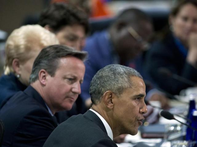 US President Barack Obama (R) speaks with British Prime Minister David Cameron at a NATO summit in Newport, Wales. (AP File Photo) US President Barack Obama (R) speaks with British Prime Minister David Cameron at a NATO summit in Newport, Wales. (AP File Photo)