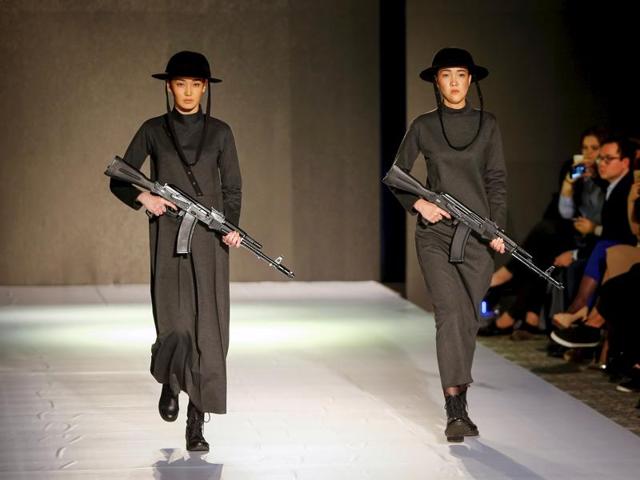 Models present creations by Kazakhstan's design house ABZAL during Kazakhstan Fashion Week in Almaty, Kazakhstan. Weird choice of props, isn’t it? (REUTERS) Models present creations by Kazakhstan's design house ABZAL during Kazakhstan Fashion Week in Almaty, Kazakhstan. Weird choice of props, isn’t it? (REUTERS)