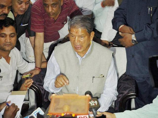 Ousted Uttarakhand chief minister Harish Rawat addressing a press conference in Dehradun on Wednesday.(PTI)