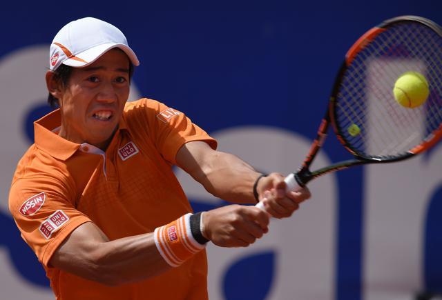 Kei Nishikori returns to Thiemo de Bakker. (AFP) Kei Nishikori returns to Thiemo de Bakker. (AFP)