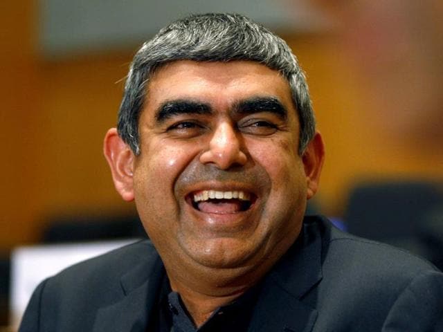 CEO and MD of Infosys Vishal Sikka smiles during a press conference at the company's headquarters in Bangalore.(AP Photo)