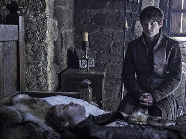 Ramsay Bolton (Iwan Rheon) sitting in front of Myranda’s (Charlotte Hope) dead body. She was thrown off the tower by Theon in last season. (HBO)