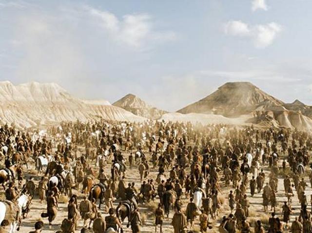 Dothraki men and women reaching the gates of Vaes Dothrak with Daenerys as their captive. (HBO)