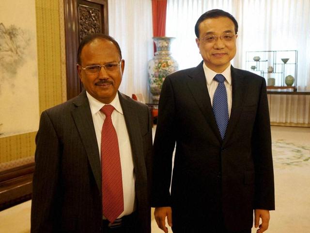National security adviser Ajit Doval with Chinese premier Li Keqiang after the 19th round of boundary talks in Beijing on Thursday.(PTI Photo)