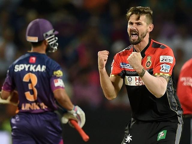 Royal Challengers Bangalore bowler Kane Richardson (C) celebrates after taking the wicket of Rising Pune Supergiants batsman Faf du Plesis. (AFP Photo) 