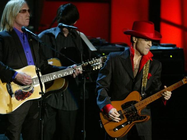 (FILES) This file photo taken on March 15, 2004 shows Prince performing a song of George Harrison along with Tom Petty after the late Beatle was inducted during the 19th Annual Rock and Roll Hall of Fame Induction Ceremony in New York City. (AFP) (FILES) This file photo taken on March 15, 2004 shows Prince performing a song of George Harrison along with Tom Petty after the late Beatle was inducted during the 19th Annual Rock and Roll Hall of Fame Induction Ceremony in New York City. (AFP)