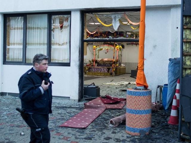 A police officer walks in front of the Sikh temple in Essen, western Germany, where an explosion took place at a wedding on April 16. (AFP Photo) A police officer walks in front of the Sikh temple in Essen, western Germany, where an explosion took place at a wedding on April 16. (AFP Photo)