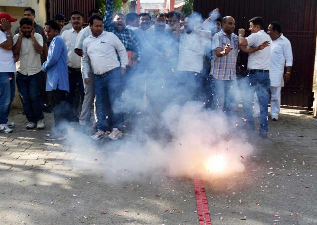 Congress supporters celebrating in Dehradun on Thursday celebrating the high court order,restoring the Harish Rawat-led state government. (PTI) Congress supporters celebrating in Dehradun on Thursday celebrating the high court order,restoring the Harish Rawat-led state government. (PTI)
